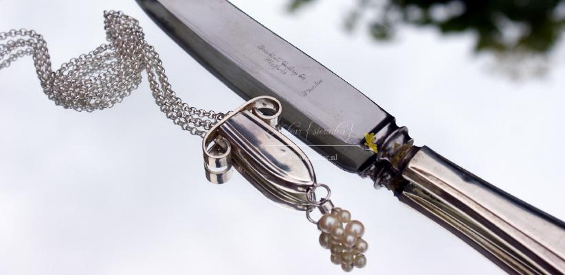 zilveren mes en sieraad van mes